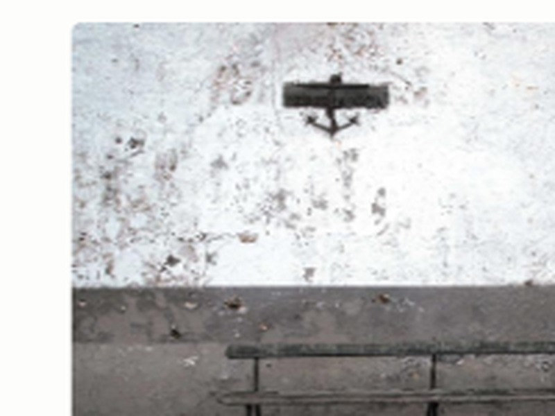 Community outreach placeholder showing a bench against a weathered wall